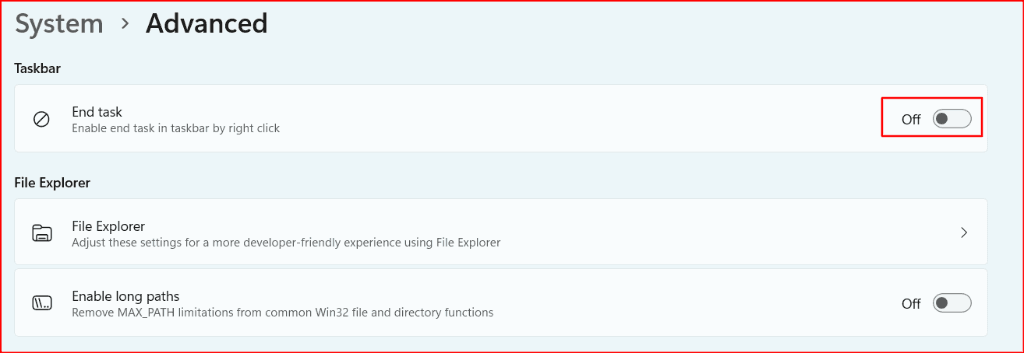 Windows 11 Settings page System then Advanced. Under Taskbar, End task says Enable end task in taskbar by right click, and the switch is Off inside a red outline.